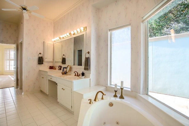 bathroom with a washtub, plenty of natural light, vanity, and ornamental molding