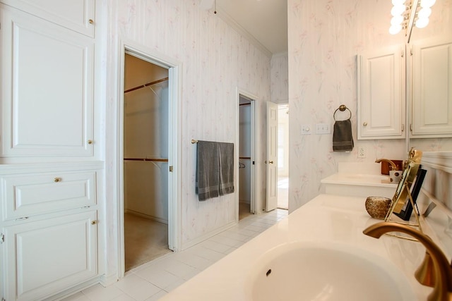 bathroom featuring tile patterned floors, vanity, and ornamental molding