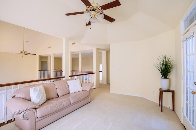 living room featuring light colored carpet, high vaulted ceiling, and ceiling fan