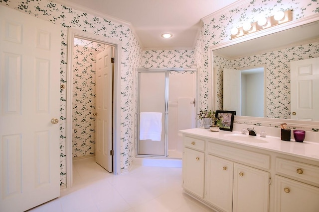 bathroom featuring crown molding, tile patterned flooring, vanity, and a shower with door