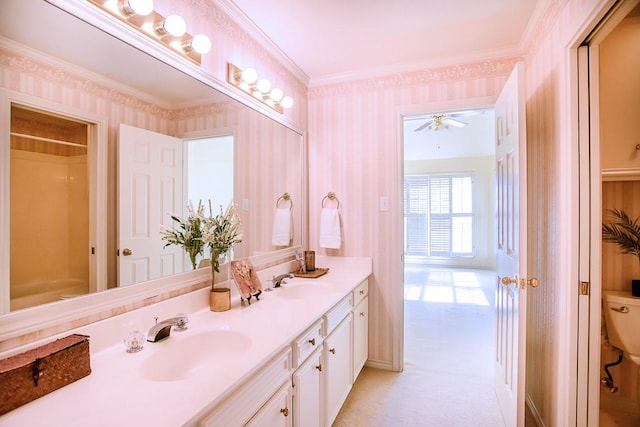 bathroom featuring vanity, ceiling fan, crown molding, a shower, and toilet