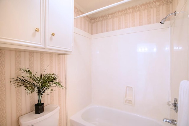 bathroom with toilet and shower / washtub combination