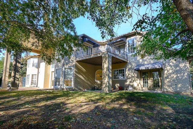 view of front of house with a wooden deck and a front yard