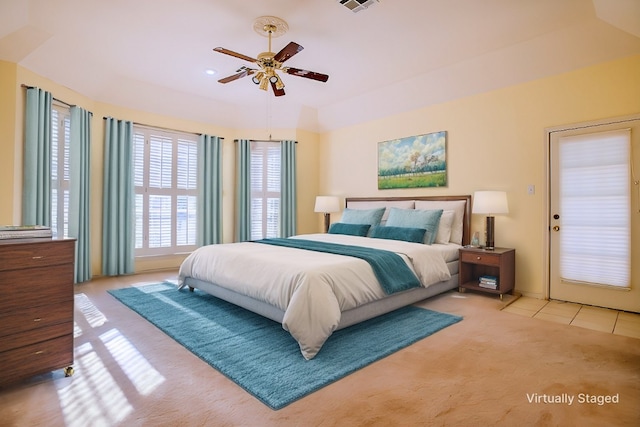 bedroom featuring light carpet and ceiling fan