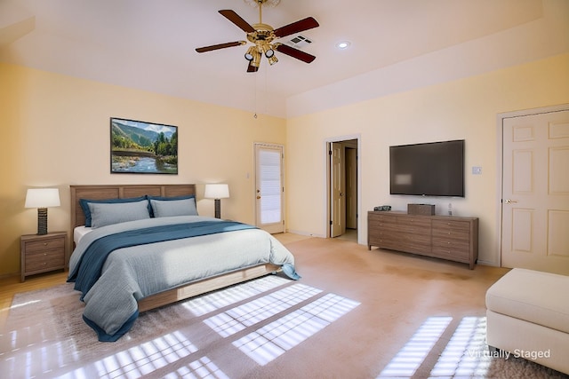 bedroom with ceiling fan and light carpet