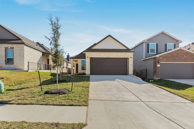 view of front facade featuring a garage and a front lawn