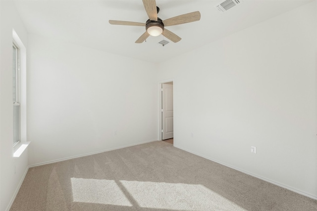 carpeted empty room with ceiling fan