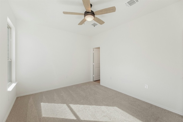 12521 Orchard Grove Ln, Manor, TX 78653 - unfurnished room with light colored carpet, a ceiling fan, and baseboards