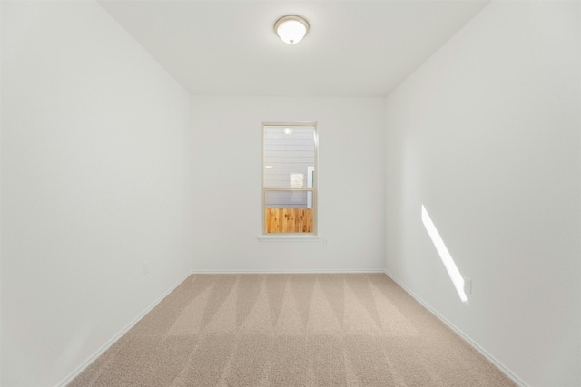 empty room featuring light colored carpet