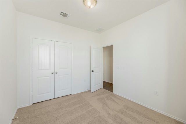 12521 Orchard Grove Ln, Manor, TX 78653 - unfurnished bedroom featuring carpet flooring, a closet, and baseboards