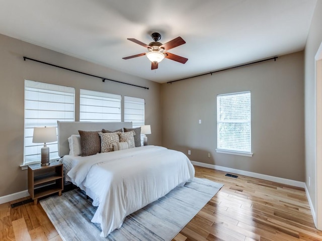 bedroom featuring light hardwood / wood-style floors and ceiling fan