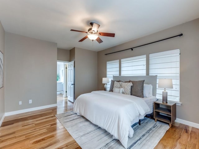 bedroom featuring light hardwood / wood-style floors and ceiling fan