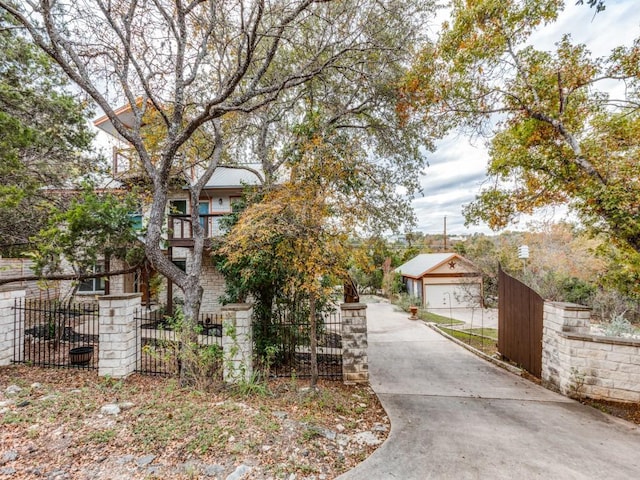 view of front of property featuring a balcony and a garage