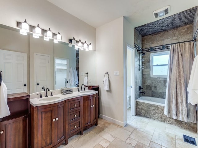 full bathroom with toilet, vanity, and shower / tub combo with curtain