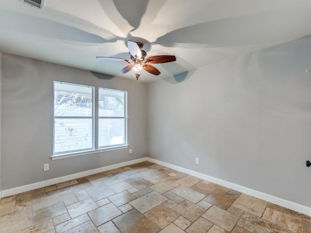 spare room with ceiling fan