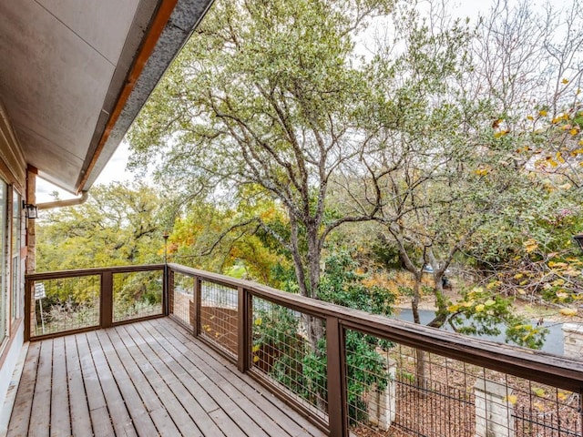 wooden deck featuring a water view