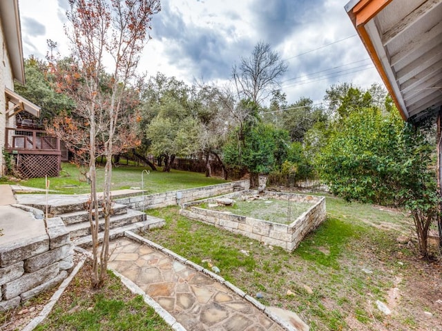 view of yard with a wooden deck