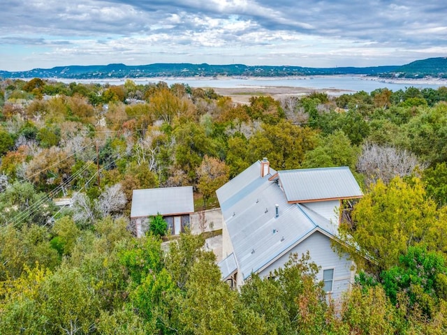 aerial view featuring a water and mountain view