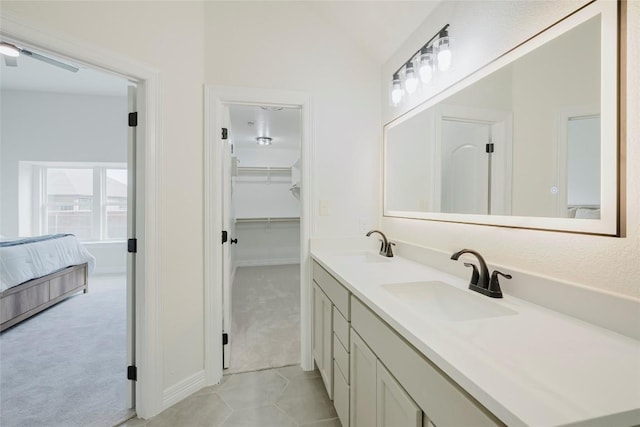 bathroom with vanity and lofted ceiling