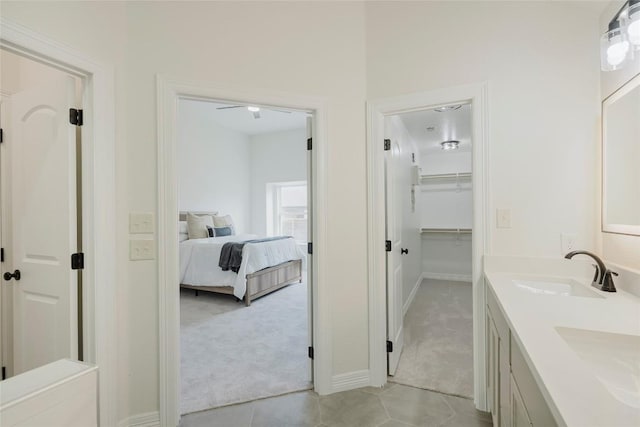 bathroom with vanity, tile patterned floors, and ceiling fan