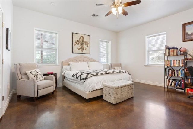 bedroom featuring ceiling fan and multiple windows