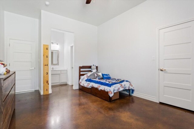 bedroom with ensuite bath and ceiling fan