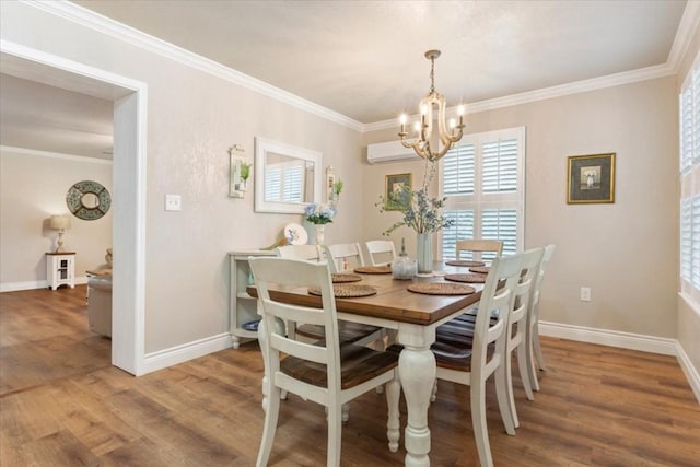 dining room with crown molding, an inviting chandelier, a wall mounted air conditioner, and hardwood / wood-style flooring