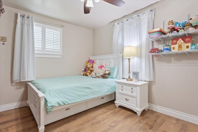 bedroom featuring ceiling fan and light hardwood / wood-style floors