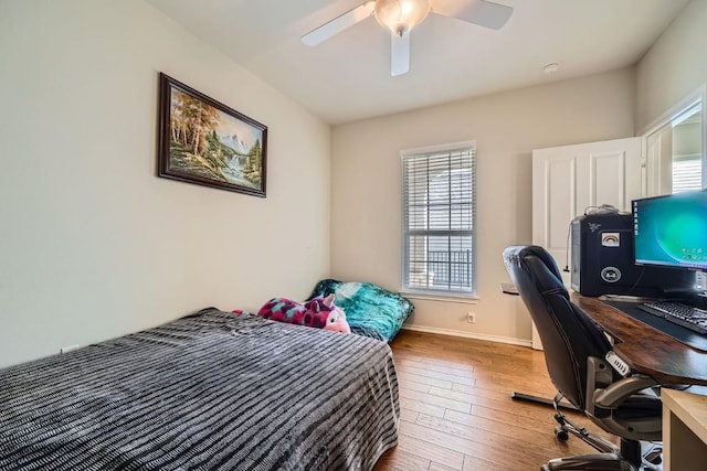 bedroom featuring ceiling fan and hardwood / wood-style flooring