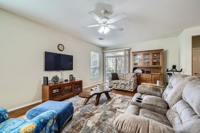 living room featuring hardwood / wood-style flooring and ceiling fan