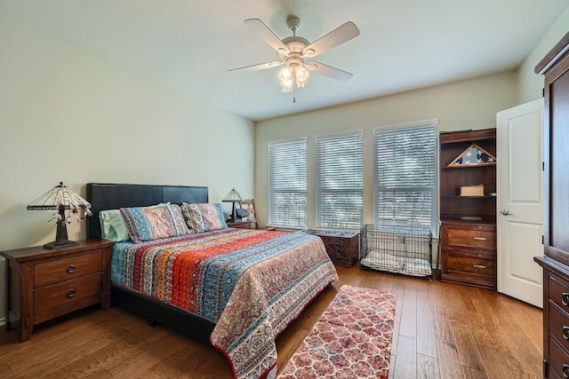 bedroom featuring light wood-type flooring and ceiling fan