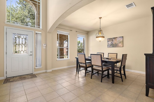 dining space featuring light tile patterned floors