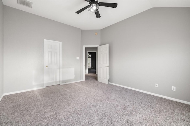 unfurnished bedroom featuring ceiling fan, lofted ceiling, and carpet floors