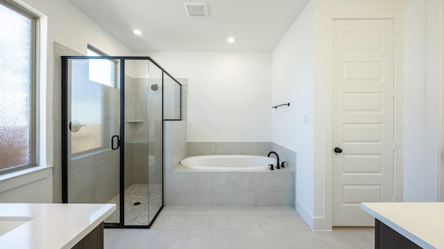 full bath with a shower stall, a garden tub, and vanity