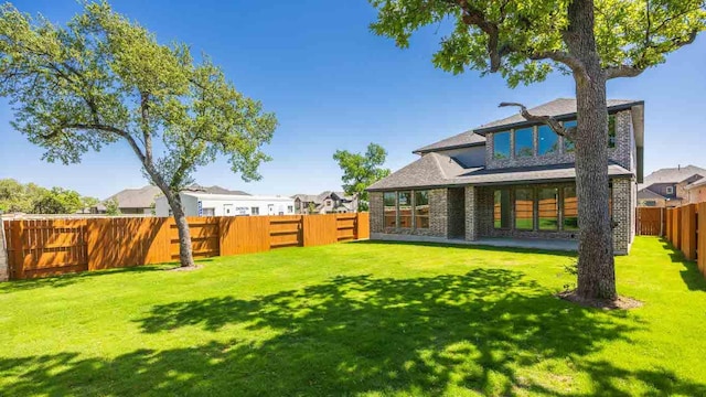 view of yard with a fenced backyard