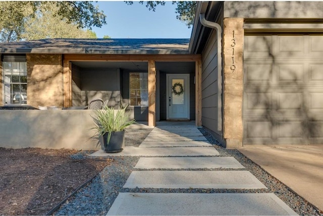 property entrance with a garage