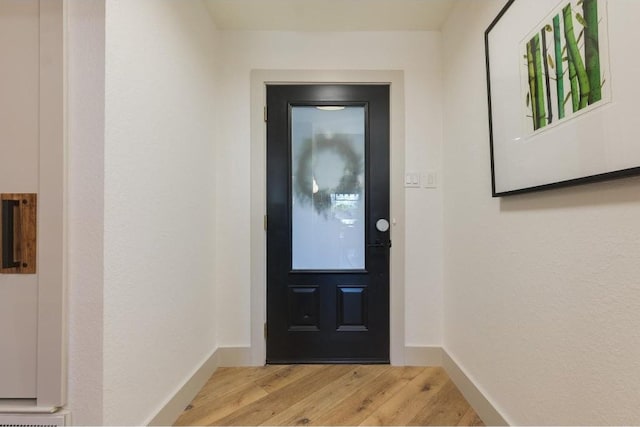 doorway to outside with hardwood / wood-style flooring