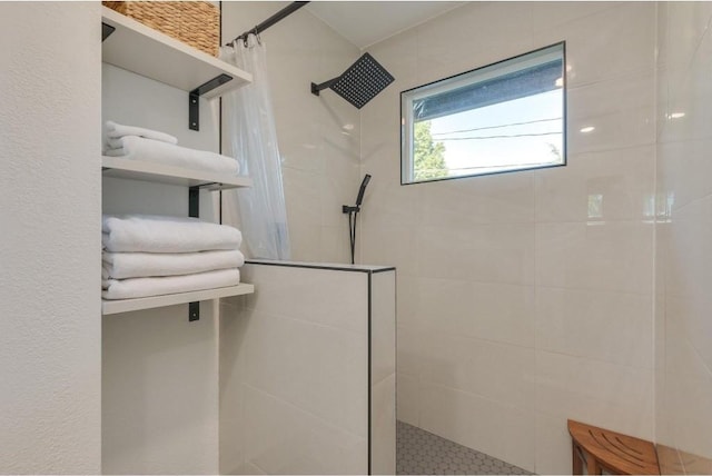 bathroom with a tile shower