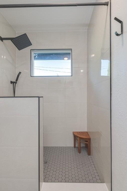 bathroom with a tile shower