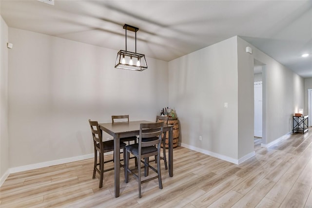 dining area with light hardwood / wood-style floors