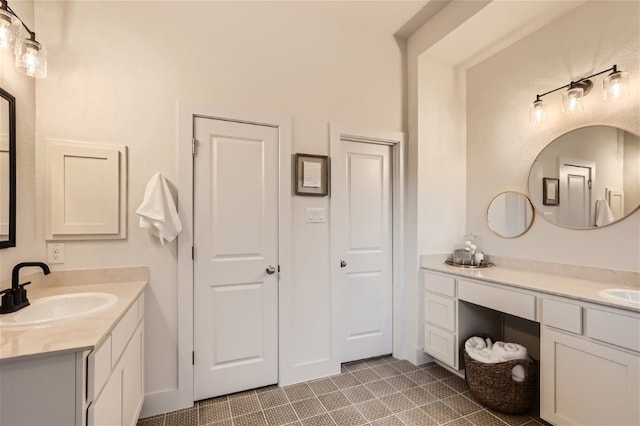 bathroom with tile patterned flooring and vanity