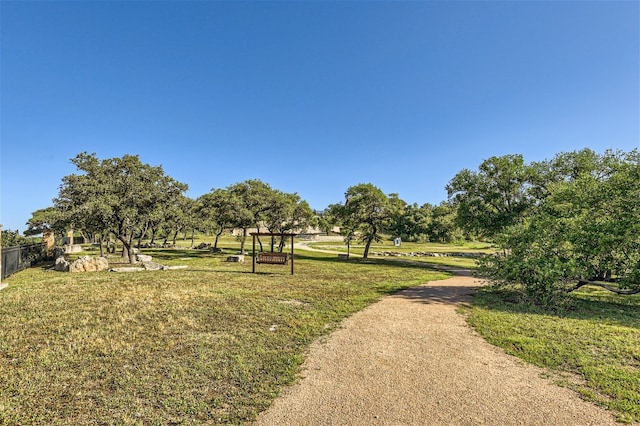 view of property's community featuring a yard