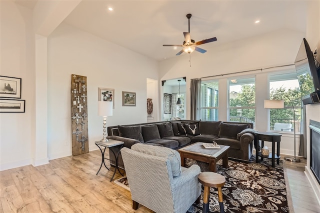 living room with ceiling fan and light wood-type flooring