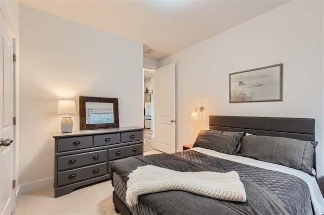 bedroom with light colored carpet