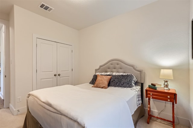 carpeted bedroom with a closet