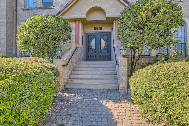 entrance to property featuring french doors