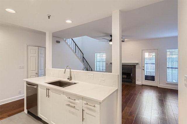 kitchen featuring sink, white cabinets, ceiling fan, and dishwasher