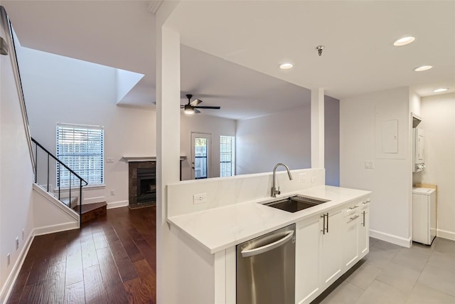 kitchen featuring white cabinets, dishwasher, a healthy amount of sunlight, ceiling fan, and sink