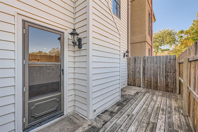 view of exterior entry featuring a deck