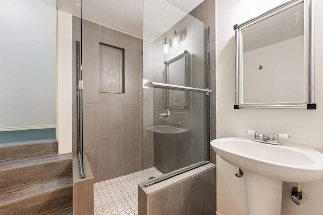 full bath featuring a sink and a stall shower